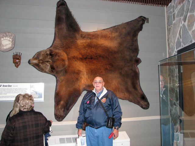 Tom in front of a Grizzly bear skin