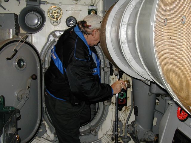 Tom going through a hatch